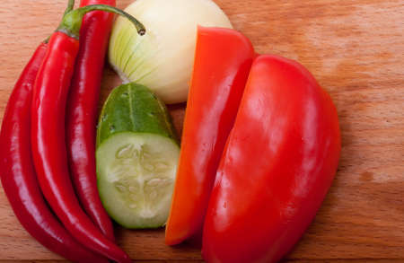 red spice on a wooden cutting boardの写真素材