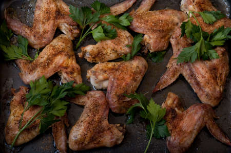 fried chicken wings on frying panの写真素材