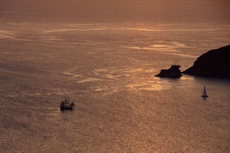 Orange sky at Santorini island, view from Imerovigliの写真素材