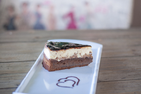 Brownie chocolate cake decorated with chocolate sauce on plateの写真素材