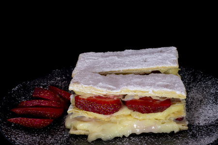 French Mille-feuille cake with fresh strawberry with isolated black backgroundの写真素材