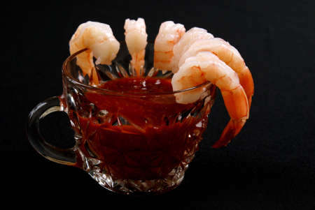A shrimp appetizer isolated on black background.の写真素材