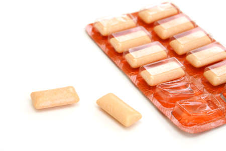 A pack of chewing gum with two pieces out of it's package.の写真素材