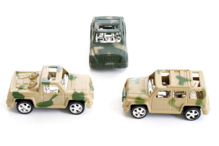Three toy military vehicles on white background.の写真素材