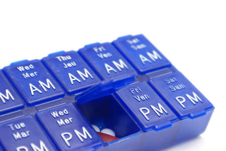 A pill case with one dose lid opened.の写真素材