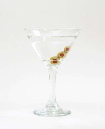 A vodka martini with three fresh olives inside.の写真素材