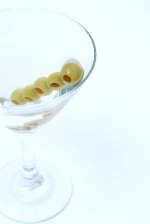 A macro shot of a martini with extra olives.の写真素材