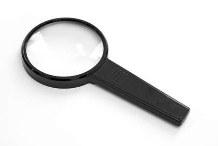 An isolated magnifying glass over white background.の写真素材