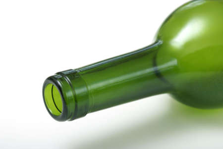 An empty wine bottle laying on it's side.の写真素材