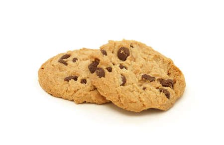 A couple of chocolate chip cookies isolated on white background.の写真素材
