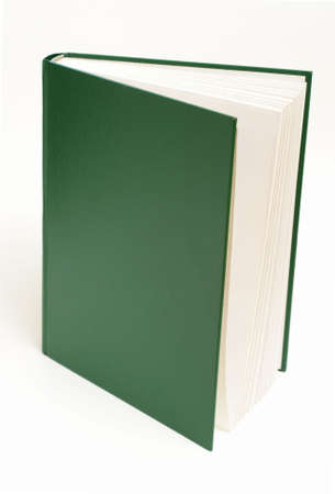 A green book is standing upright over a white background.の写真素材