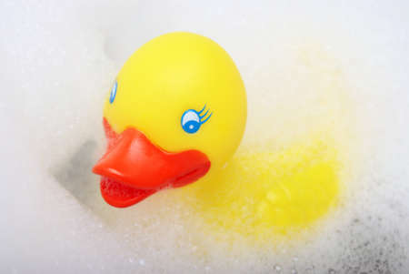 A closeup shot of a rubber duck in the bubble bath.の写真素材
