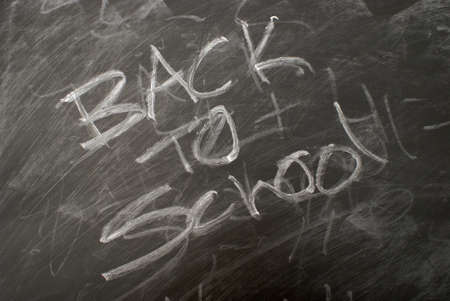 Back to school is written on a chalkboard.の写真素材