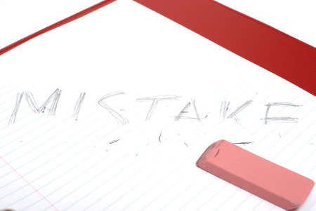 An eraser makes a correction on a mistake, to give the idea of problem solving.の写真素材
