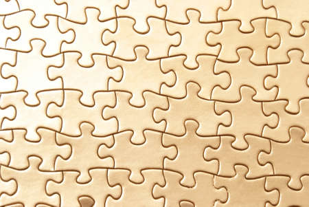 A macro shot of a completed golden puzzle.