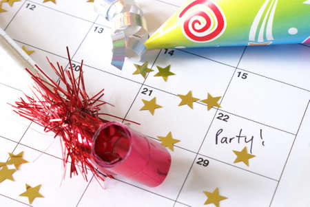 A note written on a calendar to remind you of a party on the weekend.の写真素材