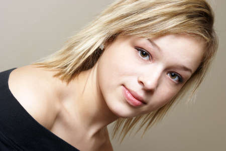 A casual portrait of an attractive young woman with a modern hairstyle.の写真素材