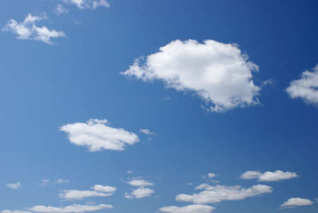 An open blue sky with various clouds.の写真素材