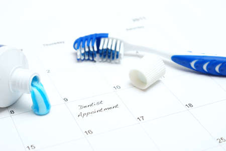 A note of a dentist appointment on a calendar reminds the patient.の写真素材