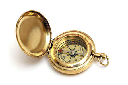 An isolated brass compass with it's hinged cover opened for viewing the directional arrows.の写真素材