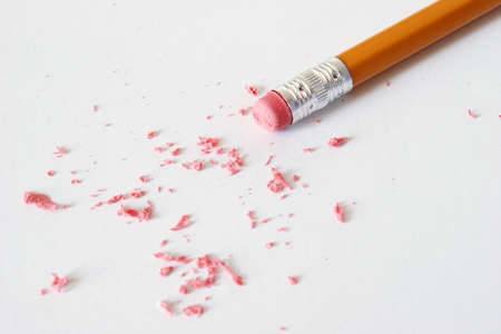 A pencil is making corrections by erasing the mistakes.