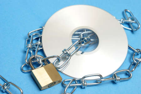 A lock and chain protect this data disk from intruders.の写真素材