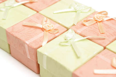 A row of pink and green jewelry boxes.