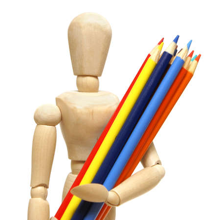 A wood mannequin holds a pencil crayons for the artist.の写真素材
