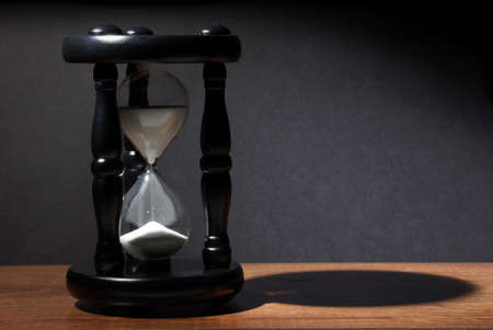 The sands of time trickle through this hourglass.