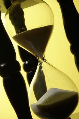 The sands of time trickle through this hourglass.