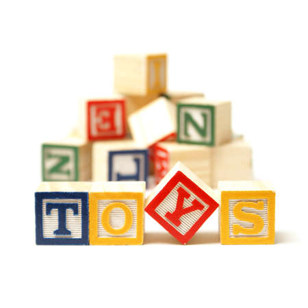 Alphabet blocks spell out the word toys with a touch of creativity.の写真素材