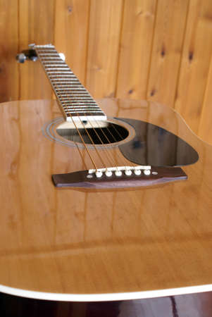 A closeup shot of an acoustic guitar.