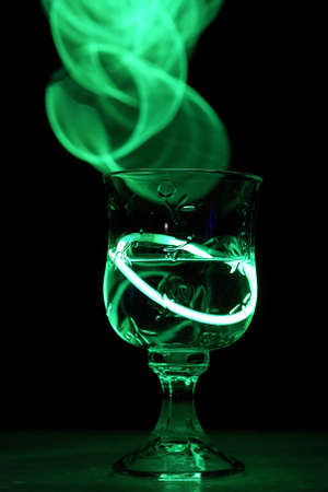 A neat party drink with an aurora glow stick.の写真素材