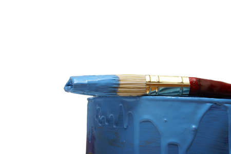 A paint brush and can with the colour blue.の写真素材