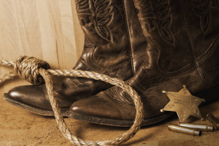 An antiqued still life on the western sheriff.  An antique technique was used and noise has been added to add a realistic effect.の写真素材