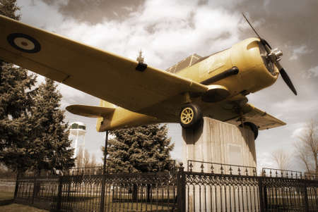 A vintage edit of an old historic war plane on display in a public park, located in Smiths Falls, Canada.のeditorial素材