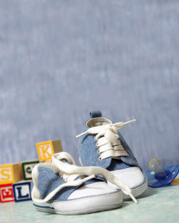 A cute pair of denim baby shoes for the young boy.の写真素材