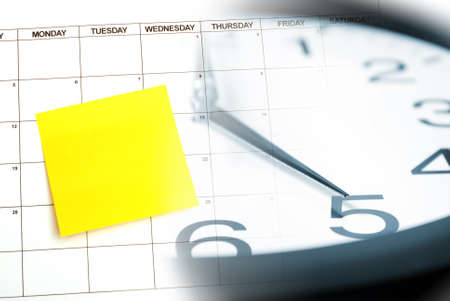 A blank sticky note for your text on a calendar as a reminder.の写真素材