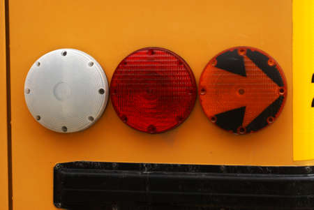 Closeup view of a school buses signal lights.