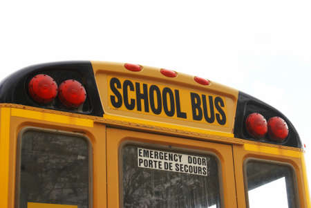 Closeup view of the back of a school bus.