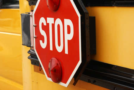 Closeup view of the stop sign on a school bus.
