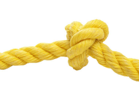 A tied knot in a yellow rope over a white background.の写真素材