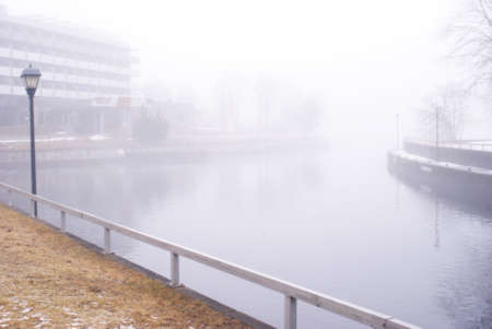 One frame of a series of images produced to emphasize the emotional and dramatic effects of the mist setting on the river bed in a local town during the seasonal changes into the early springtime.のeditorial素材