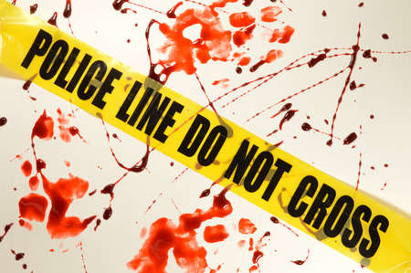 A bloody crime scene with some yellow Police line.の写真素材