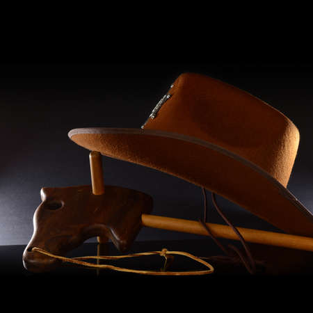 A wooden horse and hat for a playful cowboy theme.の写真素材