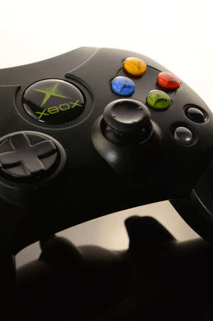 SMITHS FALLS, ONTARIO, CANADA: JANUARY 23, 2021 - An Xbox video game controller over a black and white reflective background.のeditorial素材