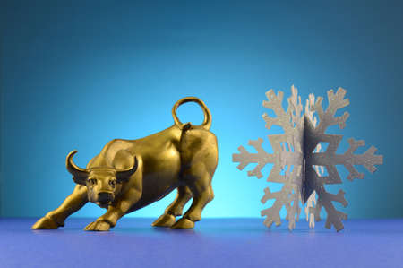 A bull and snowflake over a blue background.の写真素材