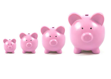 A conceptual image of pink piggy banks growing in size over time to illustrate the growth of...