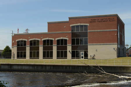 SMITHS FALLS, ONTARIO, CA, JUNE 12, 2021: An exterior shot of the Water Treatment Plant located on the Rideau Canal in Smiths Falls, Ontario.のeditorial素材