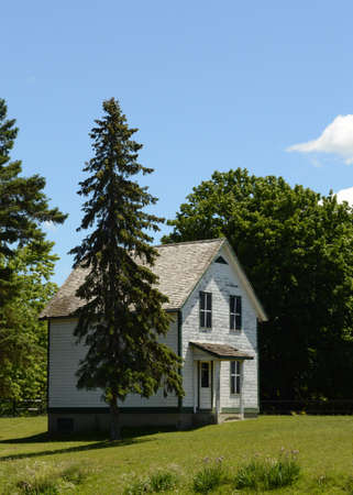 A heritage Lockmasters house located on the Rideau Canal for the staff members who operate and maintain the working lock system.の写真素材